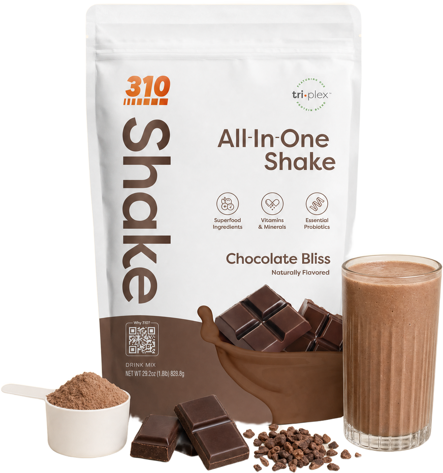 310 All-In-One Shake Chocolate Bliss pouch with a scoop of powder, dark chocolate, cocoa nibs and a blended shake