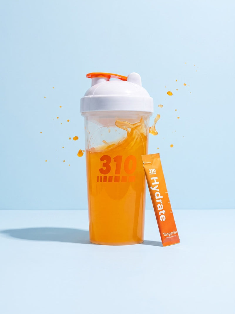 310 shaker of tangerine hydrate mid-swirl with suspended droplets