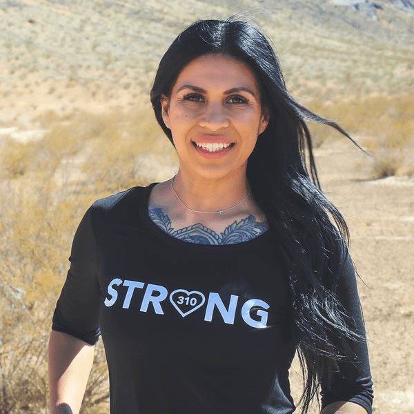 a woman in her mid-sleeve black strong shirt