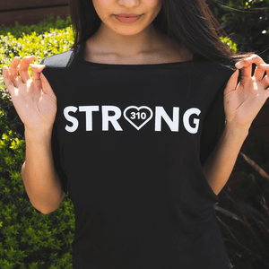woman wearing the black strong shirt