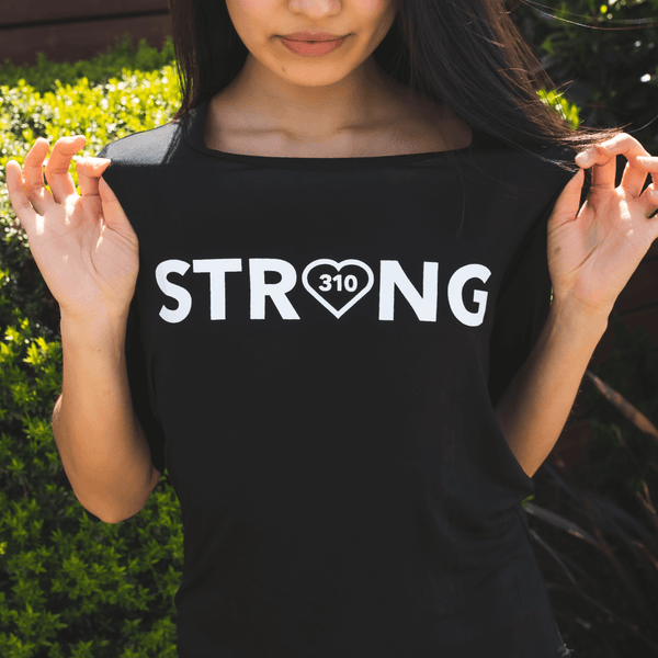 woman wearing the black strong shirt