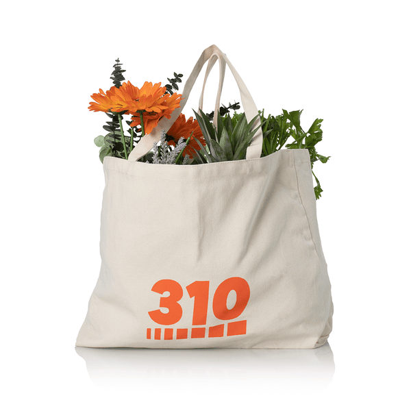 white canvas tote bag full of flowers