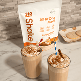 Two glasses of pumpkin spice shake with striped straw