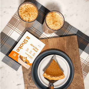 310 pumpkin spice, two glasses of shake and a slice of pie on a white plate.