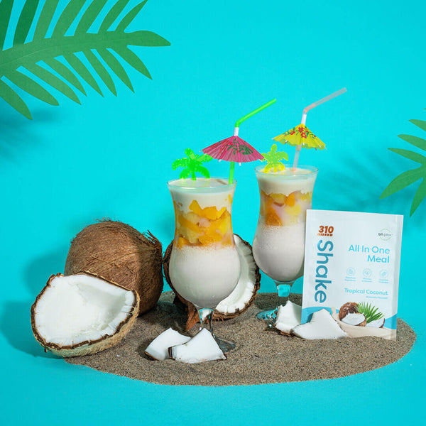A tropical-themed photo of shakes, 310 Tropical Coconut shake pouch and whole coconuts.