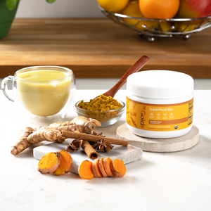 vanilla chai golds with turmeric powder roots, cinnamon and a glass of drink