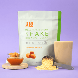 14 serving original salted caramel meal replacement, a glass of shake, powder, caramel sauce and cubes