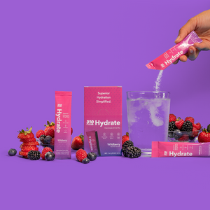 310 hydrate wildberry, a glass of water and fresh berries