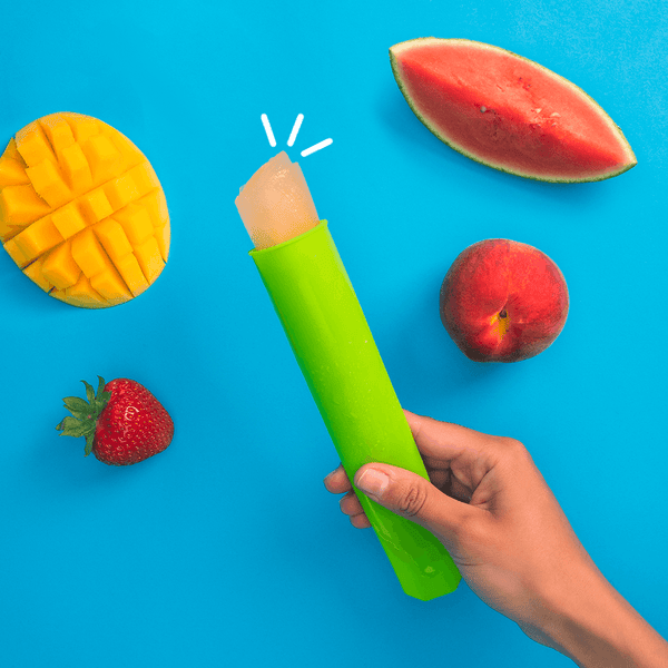 green freeze pops with fresh strawberry, apple, mango and watermelon slices