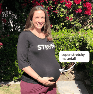 pregnant woman wearing the stretchy strong shirt